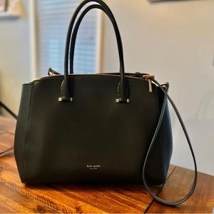 Kate spade black purse. Two zip pouches and center space for storage.